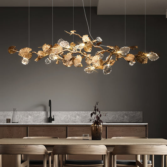 Elegant Lotus chandelier featuring delicate lotus leaf pendants made of transparent material, capturing light with a crystalline shimmer. The slender, organic brass copper branch adds warmth, while the LED lights provide a cool glow. Ideal centerpiece for a sophisticated dining area or tranquil bedroom retreat.