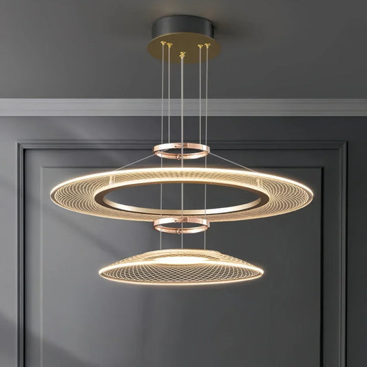 Dröme modern LED chandelier with sculptural acrylic rings and soft ambient glow, Nordic-style ceiling light ideal for living rooms, bedrooms, stairwells, and hotel lobbies.
