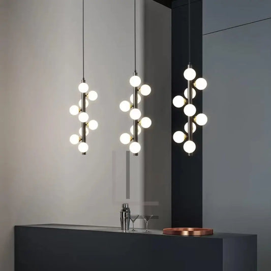 Luminate Living - Molekyl - Transform your living space into a modern, inviting ambiance with Molekyl's simple LED Chandelier. This sleek, contemporary design is perfect for any interior, from a grand staircase to a cozy bedroom. Its unique polished copper finish will add both style and illumination to any room in your home.