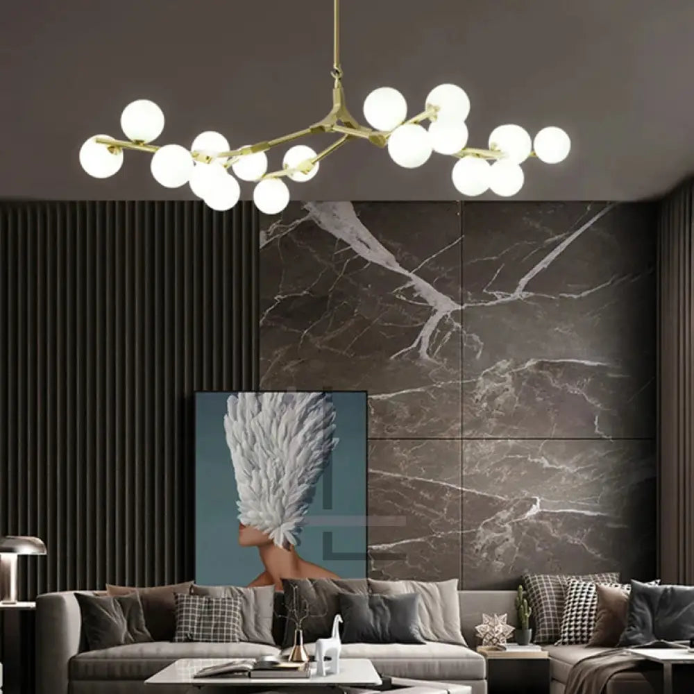 Solla ceiling light by Luminate Living - modern design, golden and black finishes, frosted glass shades, warm ambiance lighting.