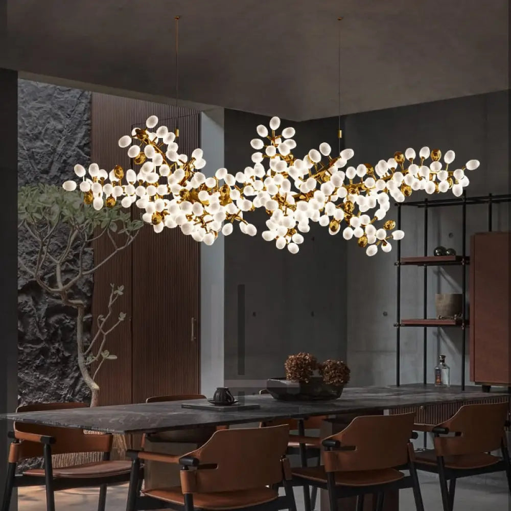 Luminate Living - Zygote High-quality white glass cluster chandelier. Organic-inspired design paired with luxury materials. Perfect for dining rooms, living areas, entrance halls, hotel areas, restaurants, etc.  White glass clusters with base frame in French gold color or Raw copper.